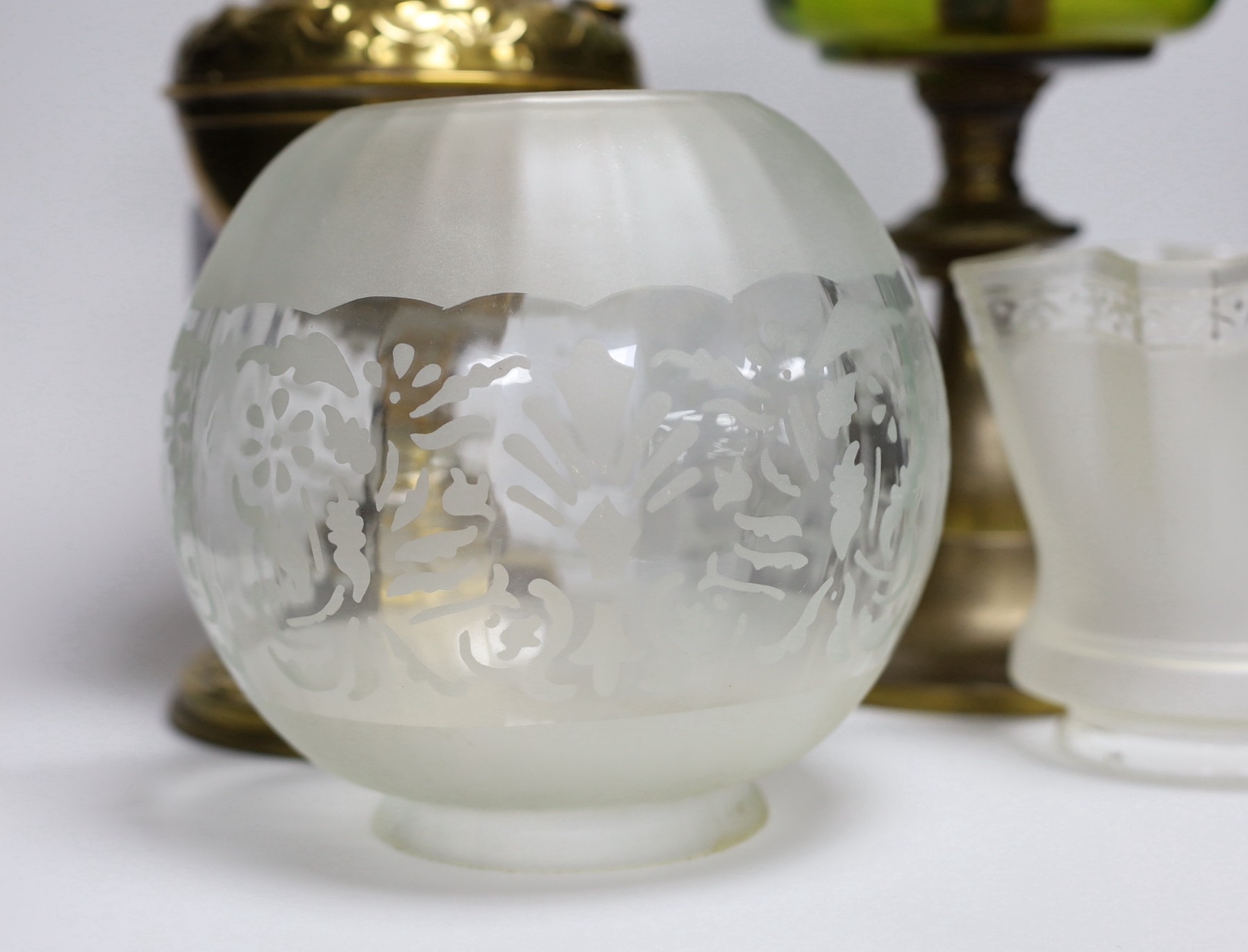 A Victorian brass oil lamp and one other lamp (2)